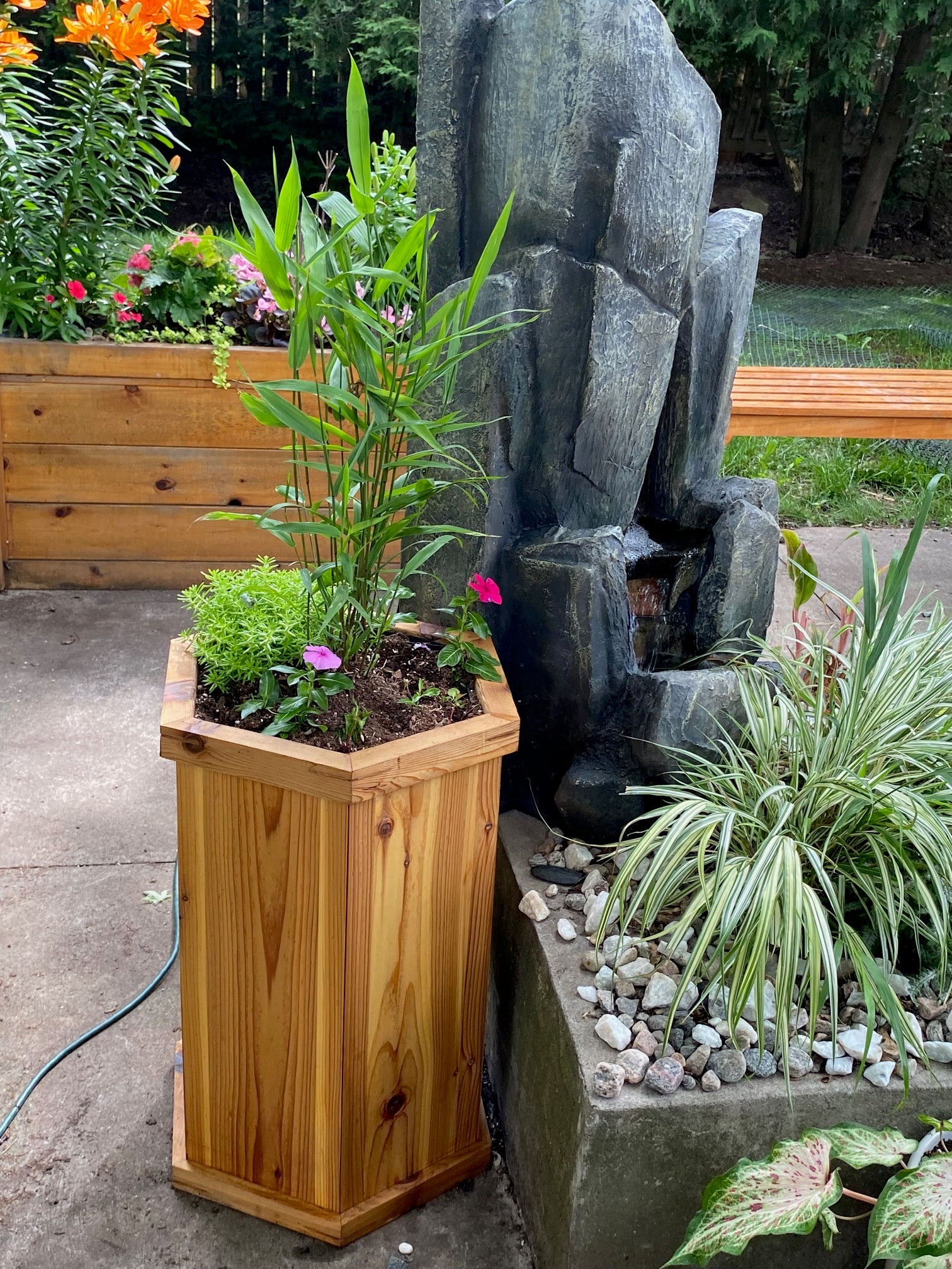 hexagonal cedar wood planter box on patio